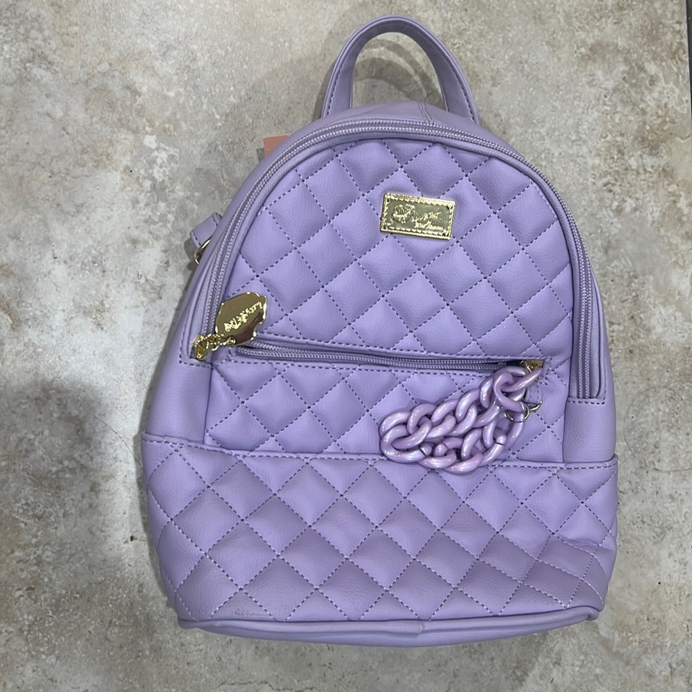 Brand new, never used small leather purple backpack.